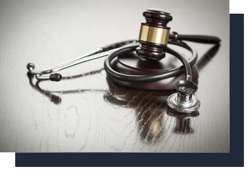 justice gavel with stethoscope on top | Kenneth M. Sigelman & Associates | San Diego, CA